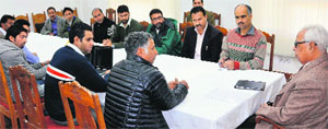 A group of local volunteers with Governor NN Vohra in Srinagar on Thursday. A tribune photograph
