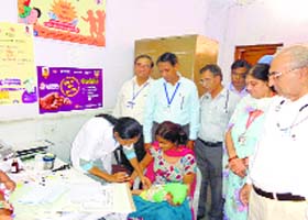 A nurse immunises an infant in Sriganganagar on Thursday