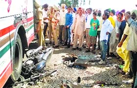 The remains of the motorcycle crushed by the bus