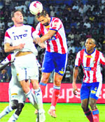 NorthEast United FC (in white) and Atletico de Kolkata players in action during their ISL match in Guwahati on Thursday. PTI 