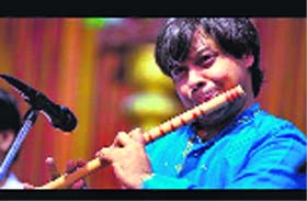 Flautist Shashank Subramanyam performs at Unison World School in Dehradun on Thursday.