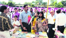District Magistrate D Senthyl Pendiyan inspects the book exhibition for government school students at Bhall Intermediate College in Haridwar on Thursday.