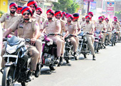 Police officials hold a flag march in Bathinda on Friday. A Tribune photograph