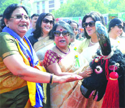 Savitri Singh (L), the wife of Home Minister Rajnath Singh, with members of Himveer Wives Welfare Association (HWWA) at the inauguration of the ITBP HWWA Mela in New Delhi on Friday. Tribune Photo