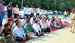 MC contractors protest outside the MC Commissioners office in Ludhiana