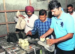 Officials of the Health Department take samples of sweets from a store in Bathinda on Saturday. a tribune photograph