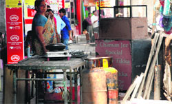 LPG cylinders kept in the corridor outside showrooms in Sector 7, Panchkula. Tribune photo: Nitin Mittal