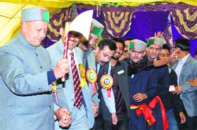 CM Virbhadra Singh performs a natti during Inter-College Youth Festival-2014 in Shimla on Saturday
