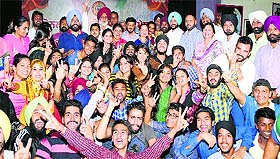 Students and staff of Lyallpur Khalsa College, Jalandhar, in a jubilant mood after winning the overall trophy at the youth festival in Guru Nanak Dev University, Amritsar. 