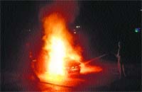 A car catches fire on the Mandi-Kullu road in Mandi on Friday night