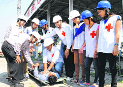 Disaster management staff with Red Cross volunteers during a mock drill in Haridwar. 