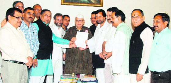 BJP members present a memorandum of demands to Governor Dr Aziz Qureshi in Dehradun on Saturday. a tribune photograph