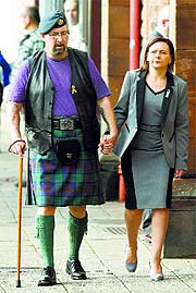 Mike Haines, brother of David Haines who was murdered by Islamic State militants in Syria, and Barbara Henning, wife of Alan Henning who was also murdered by IS militants, arrive at a church in Perth on Saturday.