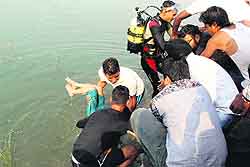 Rescue workers fish out the victims body from the water tank near the Rose Garden in Bathinda on Sunday