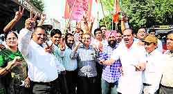 Punjab BJP workers celebrate the performance of their party in the Haryana and Maharashtra assembly polls in Bathinda on Sunday