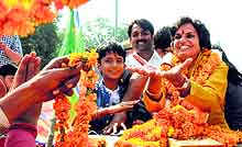 Latika Sharma, BJP candidate from Kalka, receives garlands during her victory procession at Sector 14, Panchkula, on Sunday