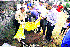 Teams of the Health Department bury unhygienic dhoda and milk barfi at Khambra in Jalandhar.