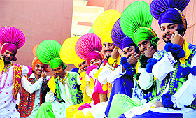 Participants of a bhangra competition pose for a photograph during the Panjab University Zonal Youth and Heritage Festival