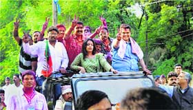 BJP leader Devendra Fadnavis celebrates along with his supporters after his victory in the Assembly elections in Nagpur on Sunday