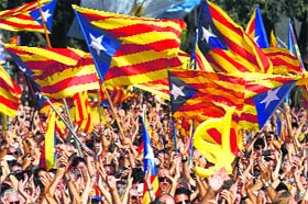 Demanding independence: People wave their Esteladas (Catalonian separatist flag) flags during a Catalan pro-independence demonstration in Barcelona on Sunday