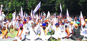 The Kisan Sangharsh Committee, Punjab, stages a dharna outside the Powercom office in Amritsar on Monday.