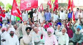 Activists of CITU stage a protest outside the Provident Fund Commissioners office in Amritsar on Monday.