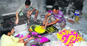 Artisans prepare edible sugar toys at a shop at Mishri Bazaar ahead of Diwali in Amritsar on Sunday.