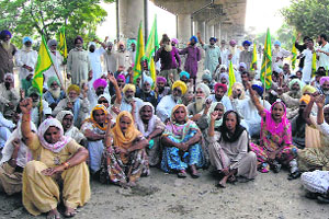 Farmers stage a dharna in Bathinda on Monday.