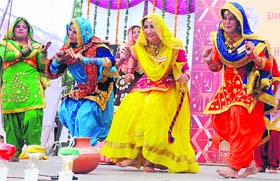 Girls perform during the Panjab University Zonal Youth and Heritage Festival - 2014 at SGGS College, Sector 26, in Chandigarh on Monday