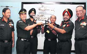 The GOC-in-C, Western Command, Lt Gen KJ Singh (second from right), hands over the Command Flight Safety Trophy to Lt Col Vikram Khatri of the 2052 Helicopter Flight at Chandimandir in Panchkula on Monday