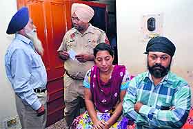 Police conduct investigation at the house where a woman was allegedly looted.at gun-point in Model Town, Jalandhar, on Monday.