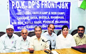 President of the PoJK Displaced Peoples Front Yudhvir Singh Chib addresses mediapersons in Jammu on Monday