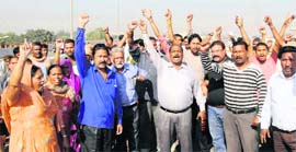 The protesting MC staff members raise slogans against the administration and the police in Amritsar on Tuesday.
