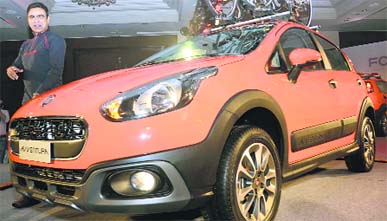 Nagesh Basavanhalli, president and managing director, Fiat Chrysler Automobile India pose with Avventura at its launch in New Delhi on Tuesday. It is priced between Rs 5.99 lakh and Rs 8.17 lakh (ex-showroom, Delhi).