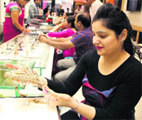A woman looks at jewellery in a shop on the occasion of Dhanteras in Bathinda on Tuesday.