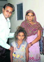 Prince, who had gone missing for the last two months, being handed over to his parents. 