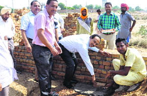 Chief Administrator of the Bathinda Development Authority (BDA) lays the foundation stone of a house in Phase IV and V on Tuesday