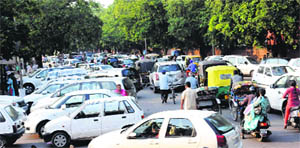 Motorists stuck in a traffic jam at Sector 19 in Chandigarh on Tuesday