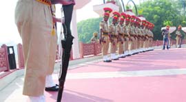 Delhi Police personnel pay homage to the martyrs at the Police Commemoration Day Parade at New Police Lines in New Delhi on Tuesday.