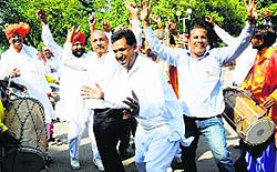 BJP supporters celebrate the announcement of Karnal MLA Manohar Lal Khattars elevation as the Chief Minister in Chandigarh on Tuesday