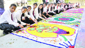 Participants of the rangoli competition at GAV School in Kangra on Tuesday.