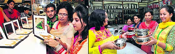 City residents shop for gold ornaments and jewellery on Dhanteras; and (right) women buy steel utensils on the occasion in Jalandhar on Tuesday. 