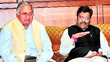 Kamal Sharma (right), state BJP president, and state minister Madan Mohan Mittal speak to mediapersons at the Punjab Bhawan in Chandigarh on Tuesday