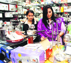 Women buy utencils on the occasion of Dhanteras in Dehradun on Tuesday.