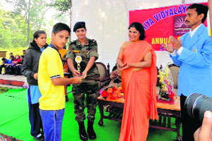 A student gets an award at the annual day function of Kendriya Vidyalaya, FRI, in Dehradun on Tuesday.