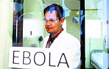 A doctor stands in an isolation room of a hospital at Alabang, Philippines, on Tuesday