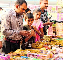 Children buy crackers on eve of Diwali in Bathinda on Wednesday