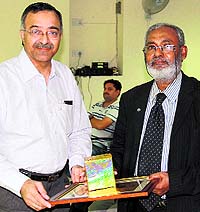 VC of the Central University of Punjab felicitates Prof M Shamsher Ali, founder Vice-Chancellor of Southeast University, Bangladesh, in Bathinda on Wednesday
