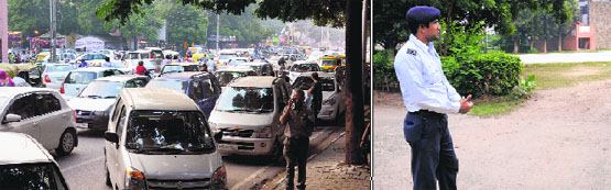 Cars parked on the roadside at a market in Sector 22 even as the nearby parking of GMSSS-22 wears a deserted look in Chandigarh on Wednesday. Tribune photos: Manoj Mahajan