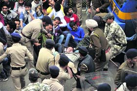 A file photo of students being detained by policemen during a protest against fee hike in Shimla